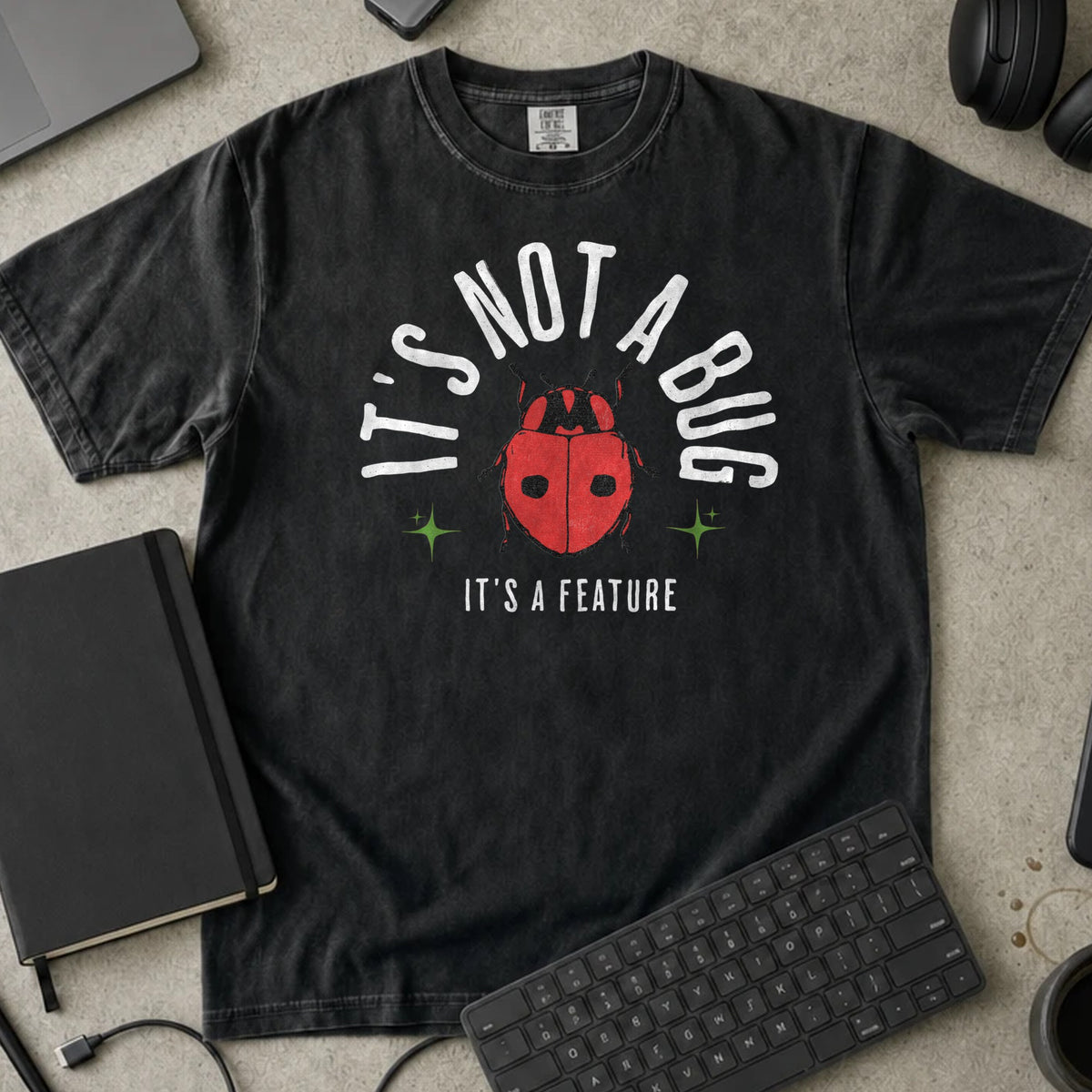 It's Not a Bug It's a Feature Shirt in Black, Comfort Colors 1717 tee flat lay