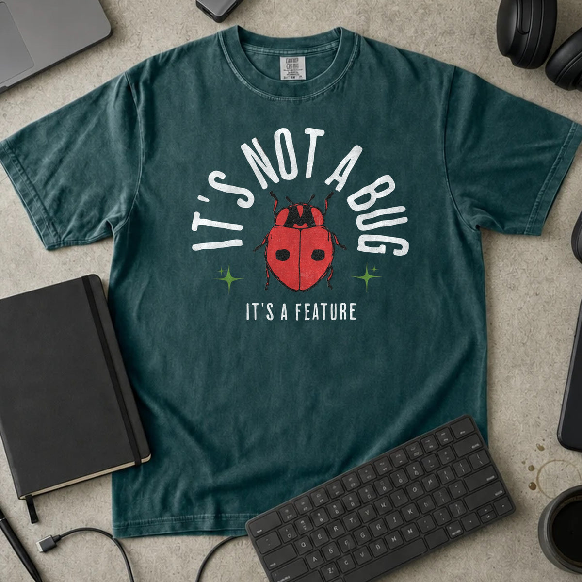 It's Not a Bug It's a Feature Shirt in Blue Spruce, Comfort Colors 1717 tee flat lay