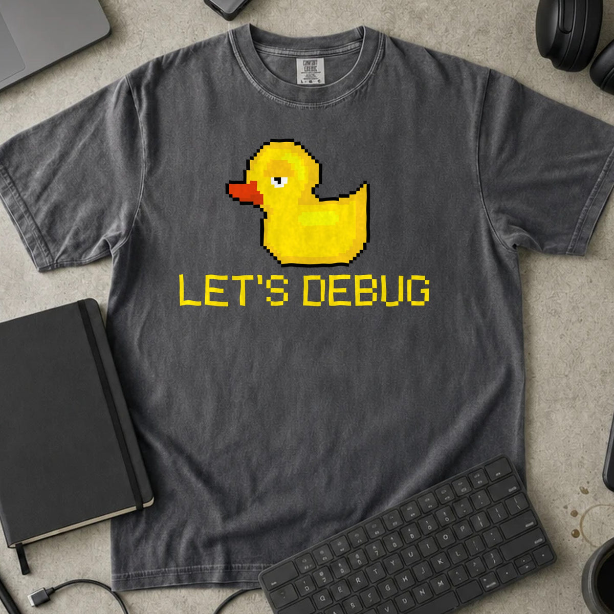 Let's Debug Pixel Duck Shirt in Pepper, Comfort Colors 1717 tee flat lay